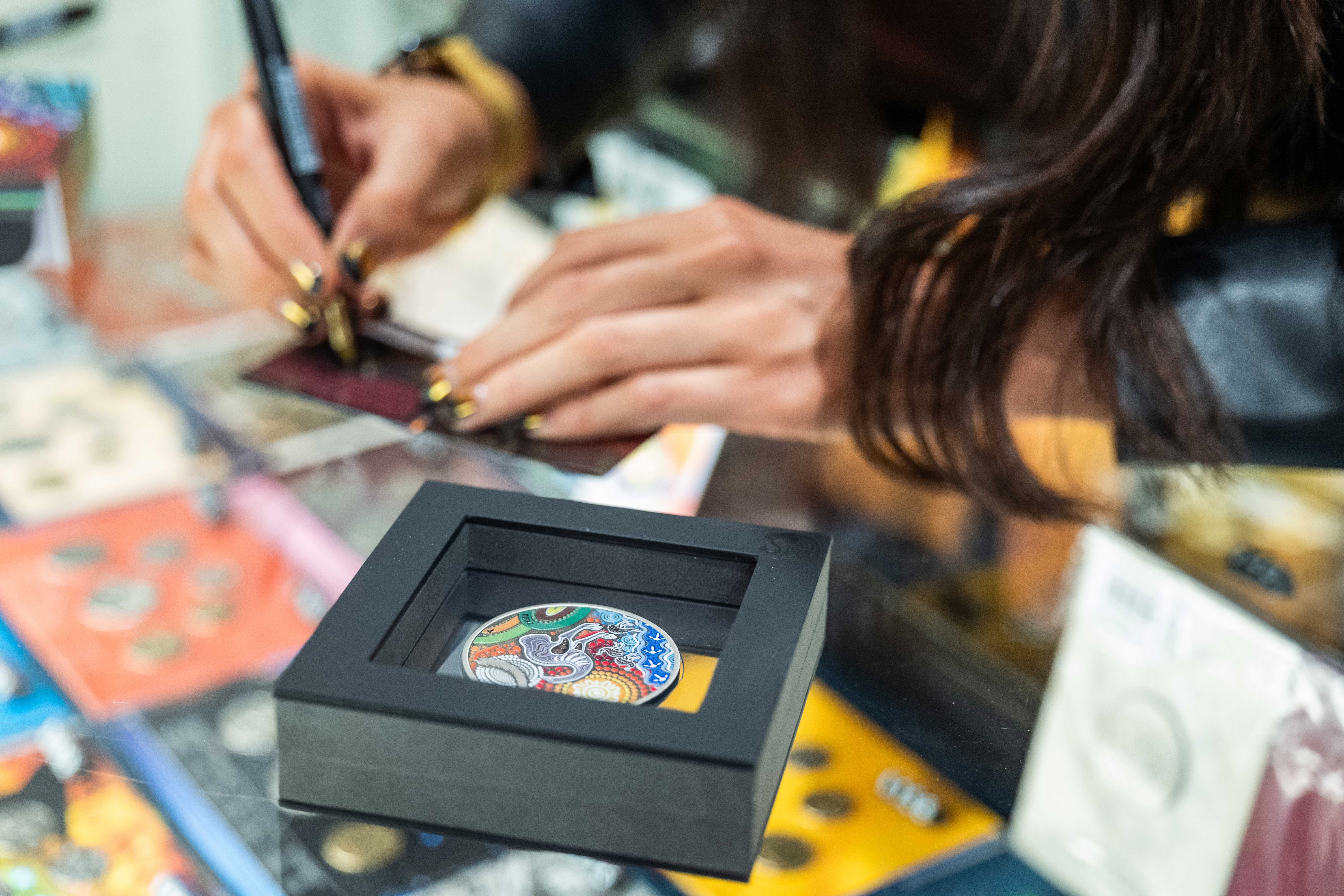 Chern'ee Sutton signing certificates